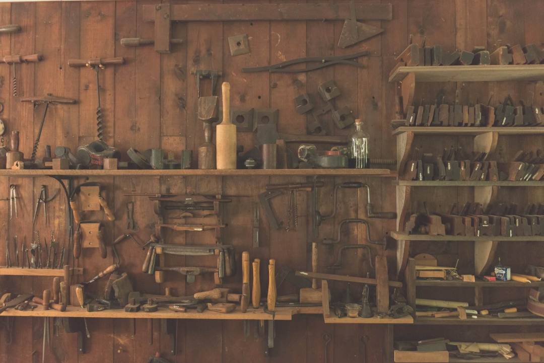 Wooden Shed With Assorted And Organised Tools On Shelves